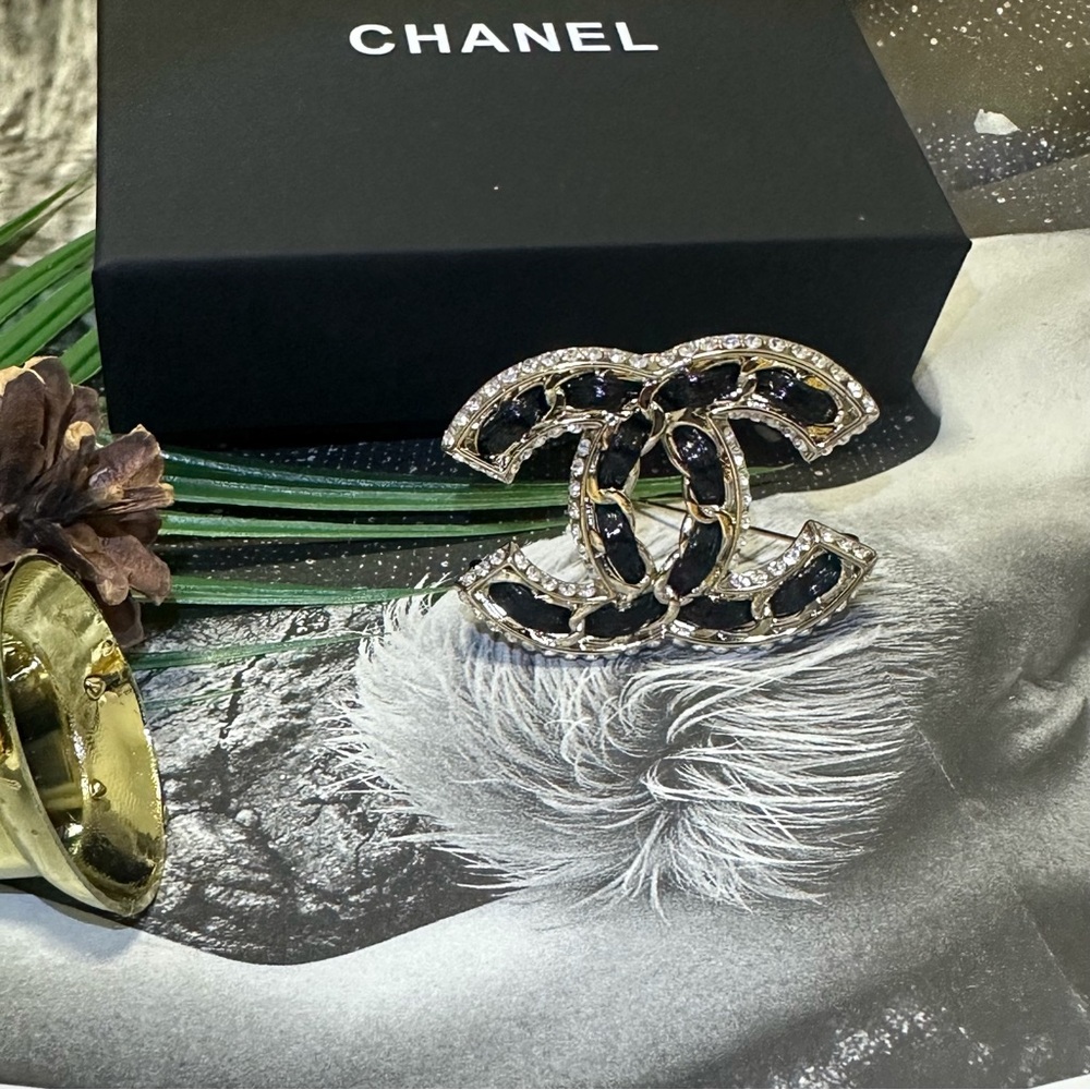 Authentic Chanel silver and black brooch